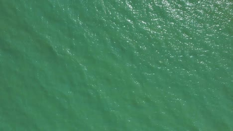 Afternoon-high-drone-view-from-the-Lake-Balaton's-waves-and-its-water-roof-near-the-shore-of-Zamárdi,-Lake-Balaton