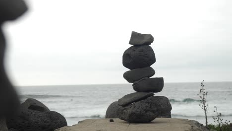 pile-of-stacked-stones-near-the-ocean