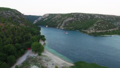 A-ferry-boat-traversing-the-water-of-Skradin-in-Šibenik-Knin-County-Croatia