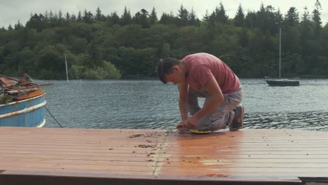 Carpenter-takes-a-break-from-working-on-cabin-roof