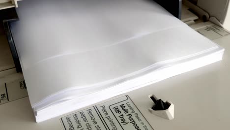 Close-Up-shot-of-Office-printer-document-in-the-process-are-working-and-the-sheets-copier-with-white-paper