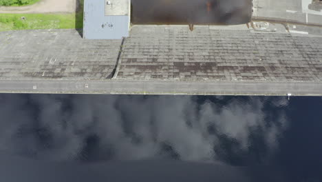 An-aerial,-close-overhead-view-of-Loch-Cluanie-and-Cluanie-dam