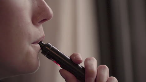 Close-up-of-a-woman-Vaping-in-slow-motion