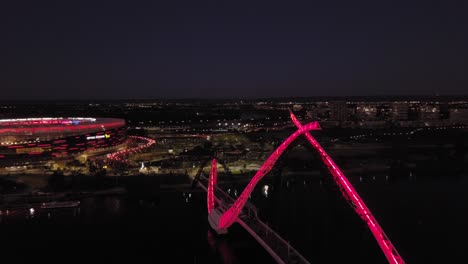 Aerial-view-of-a-Matagarup-Bridge-on-the-Swan-river-revealing-the-Optus-Stadium-in-Perth-with-ongoing-game-between-Man-Utd-vs-Perth-Glory