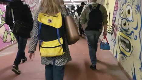 Florence,-Italy---circa-July-2019---Young-girl-walking-with-a-school-back-pack-of-80s