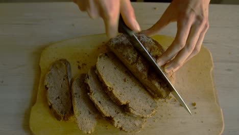 White-female-cutting-buckwheat-bread