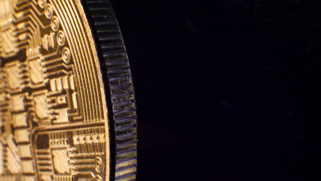 Close-up-looping-shot-of-a-golden-digital-cryptocurrency-bitcoin-with-room-for-titles-and-copy-space-as-banners-or-backgrounds