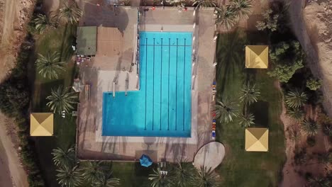 Drone-view-of-a-swimming-pool-in-the-middle-of-the-desert