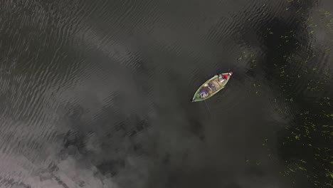 Fisherman-in-the-boat-wide-view-from-above-aerial
