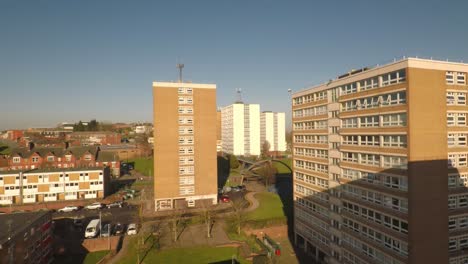 Aerial-footage-view-of-high-rise-tower-blocks,-flats-built-in-the-city-of-Stoke-on-Trent-to-accommodate-the-increasing-population,-council-housing-crisis,-Immigration-housing