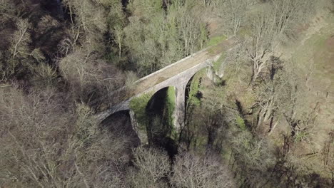 Aerial-footage-Den-Finella-disused-viaduct-on-a-sunny-day-in-Aberdeenshire,-Scotland