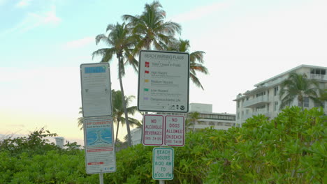 Warning-signs-posted-at-a-tropical-beach