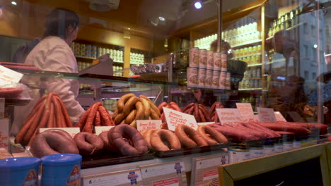 Multiple-people-ordering-fresh-meats-at-a-Munich-butcher-shop