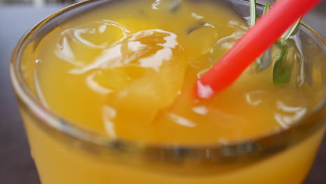 Cold-orange-drink-in-a-thick-glass-Close-up