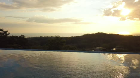 Beautiful-infinite-pool-in-a-tropical-mansion-during-sunset