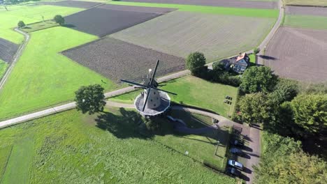 Aerial-footage-frontview-of-windmill-in-countryside