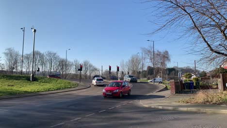 A-busy-cross-intersection-in-Britain-on-a-warm-sunny-spring-morning