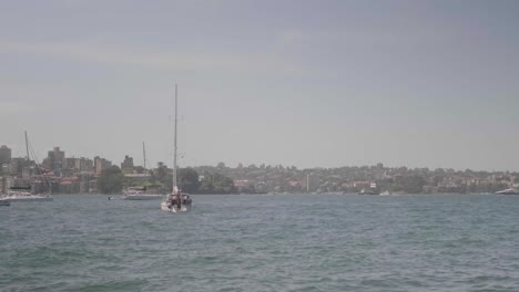 View-of-a-small-sailing-boat-during-a-sunny-day-in-Sydney,-Australia