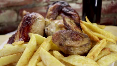 Dolly-out,-medium-close-up-on-full-grilled-chicken-and-chips