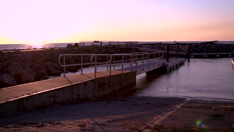 Sunset-sunrise-pan-of-boat-ramp-along-Lake-Erie