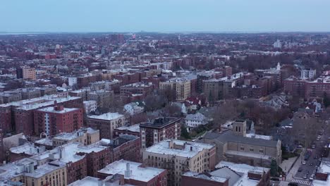 Long-drone-flyover-central-Brooklyn,-New-York,-right-before-sunset