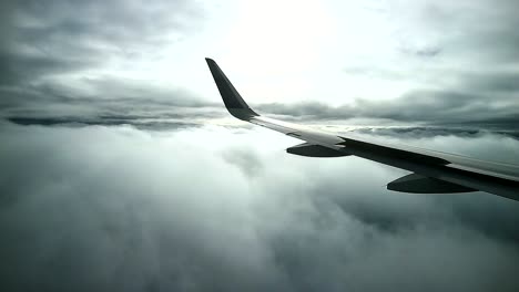 commercial-airplane-flight-through-dramatic-dark-cloudy-sky