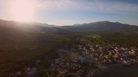 Aerial:-A-small-fishing-village-on-Samos-during-sunset