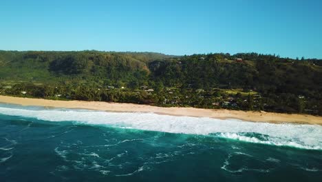 4K-Drone-shot-capturing-the-North-Shore-of-Oahu-on-a-sunny-day-and-clear-blue-water