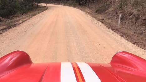 A-trip-along-a-dirt-road-in-Victoria-Australia-in-a-Porsche-Targa-that-has-been-set-up-for-rallying