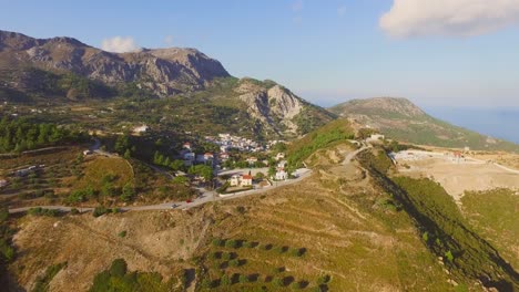 Aerial:-Small-villages-in-the-mountains-of-Karpathos,-Greece