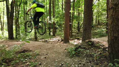Jump-through-the-gap-with-mountain-bike-while-doing-a-downhill-ride