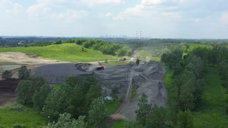 Aerial-view-loading-bulldozer-in-open-air-quarry