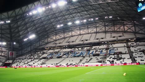A-panning-shot-from-the-pitch-of-the-Stade-Vélodrome,-in-Marseille,-just-before-the-football-game-between-Olympique-de-Marseille-and-Lille