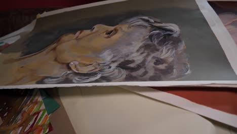 Long-slide-over-paintings,-drawings-,-acrylic,-charcoal-and-colour-chalk-portraits