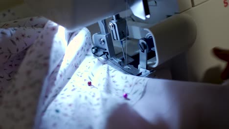 close-up-footage-of-sewing-machine-at-night-time