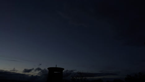 Time-lapsed-view-of-sky-and-clouds-as-night-falls-near-World-War-II-era-watchtower