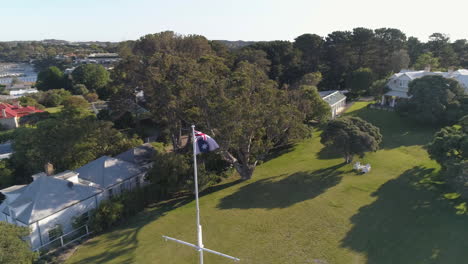 Australian-Flag-Aerial-Orbit-by-the-Ocean