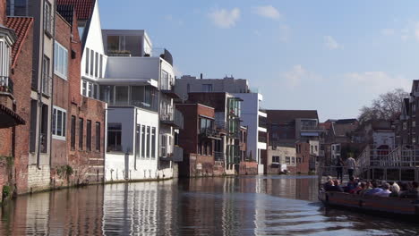 sightseeing-on-the-inner-city-river-with-a-tourist-boat,-Dijle-River