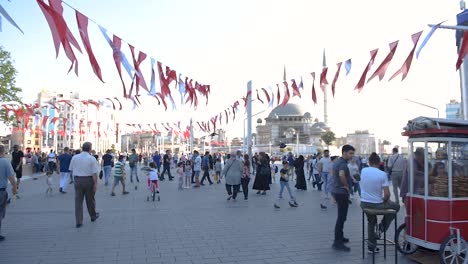Locals-and-tourists-walk-and-explore-at-popular-Taksim-Square-in-Beyoglu,Turkey