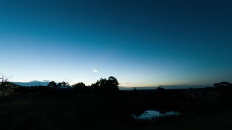 Peaceful-Australian-bushland-nightlapse-with-a-setting-moon-and-the-stars-emerging
