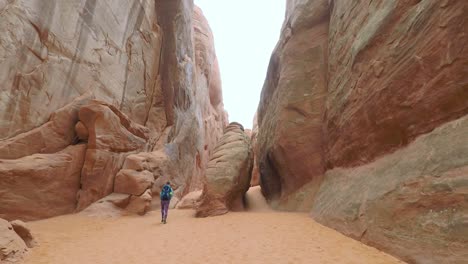Young-woman-hiking-in-Arches-National-Park