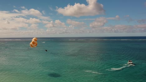 Aerial-shot-of-a-couple-practicing-parasailing