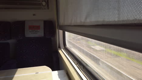 Empty-seat-in-a-train-in-Morocco-near-the-glass---first-class