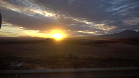 Slowmotion-shot-of-a-Nice-Sunset-in-Africa,-shot-from-a-Moving-Car