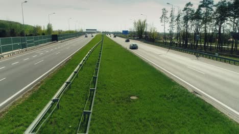 Aerial-view-of-a-multiple-lane-highway,-camera-lifting-up