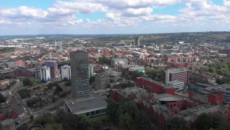 The-University-of-Sheffield-The-Arts-Tower-from-Weston-Park-with-City-of-Sheffield-in-the-background-Sunny-Summer-day-arts-tower-framed-left-wide-static-4K-30FPS