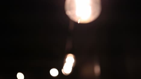 Dream-like-string-of-Edison-bulbs-at-night,-mood-setting
