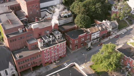Aerial-orbit-over-Yungling-Brewery-on-a-sunny-morning,-Pottsville,-PA