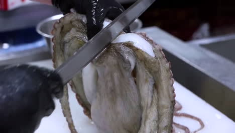 A-chef-cleans-octopus.-Raw-seafood