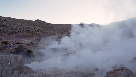 El-Tatio-geysers-steaming-before-sunrise-in-the-Atacama-desert-in-Chile,-South-America